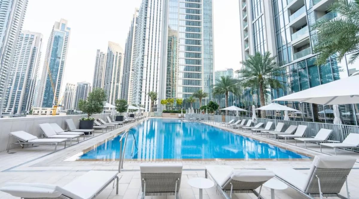 Residents’ pool deck with sun loungers at Forte, Downtown Dubai