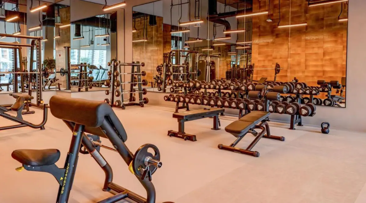 Residents’ gym with weights and machines at Forte